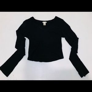 Long sleeve v neck top in black.